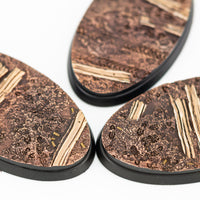 Gros plan sur la texture d'un socle ovale No Man's Land 75×42 mm